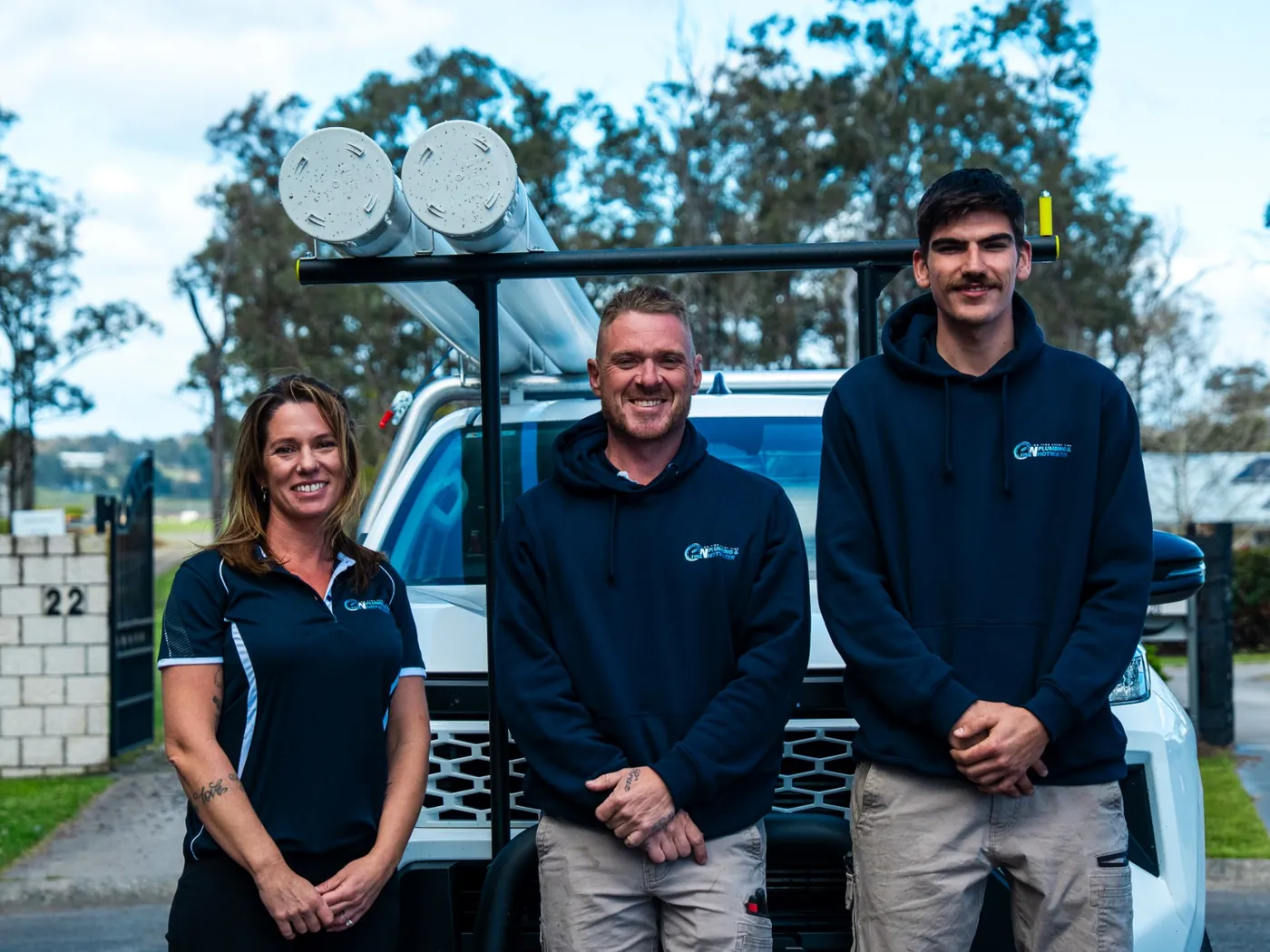 The On Time Plumbing & Hot Water team in front of a service ute