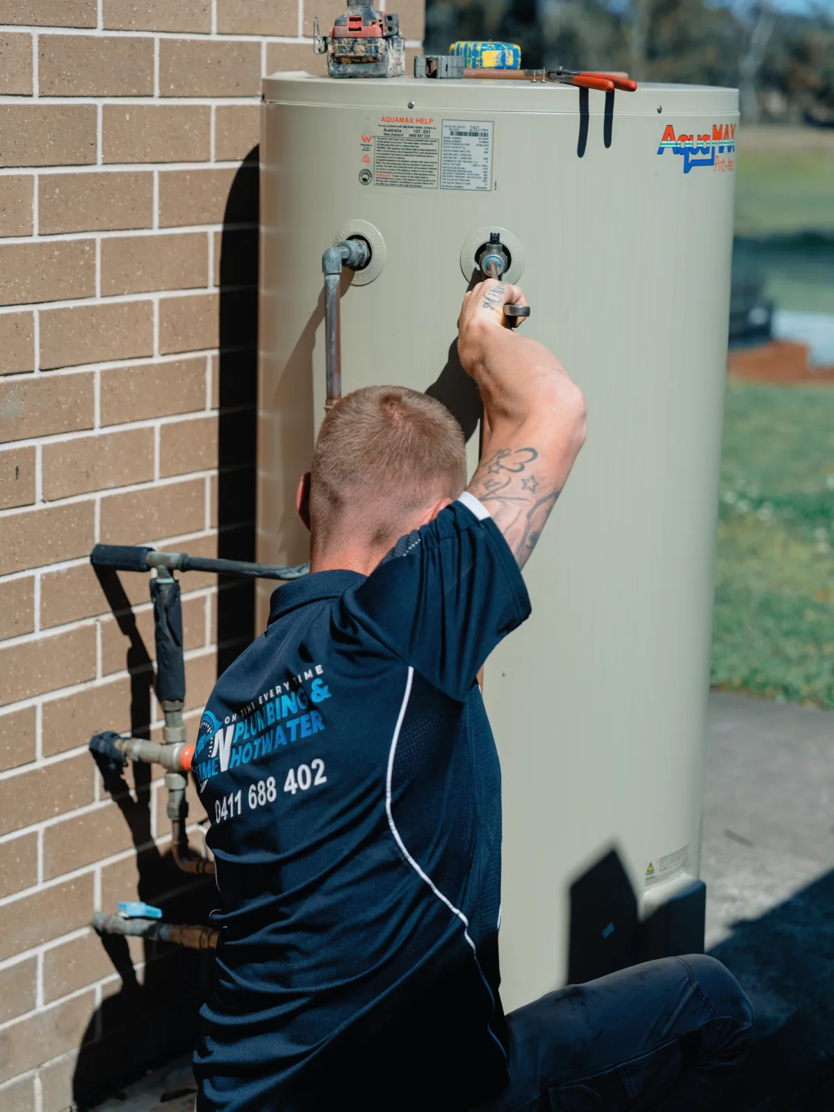 On Time Plumbing & Hot Water plumber servicing a hot water system